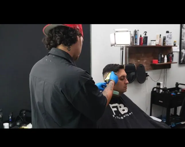 Issa B., barber at Mad Barbers Avalon Park